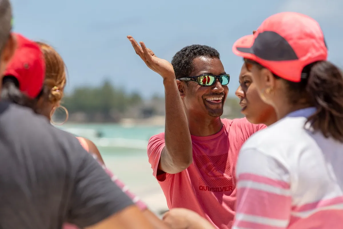 Event facilitator briefing on the beach