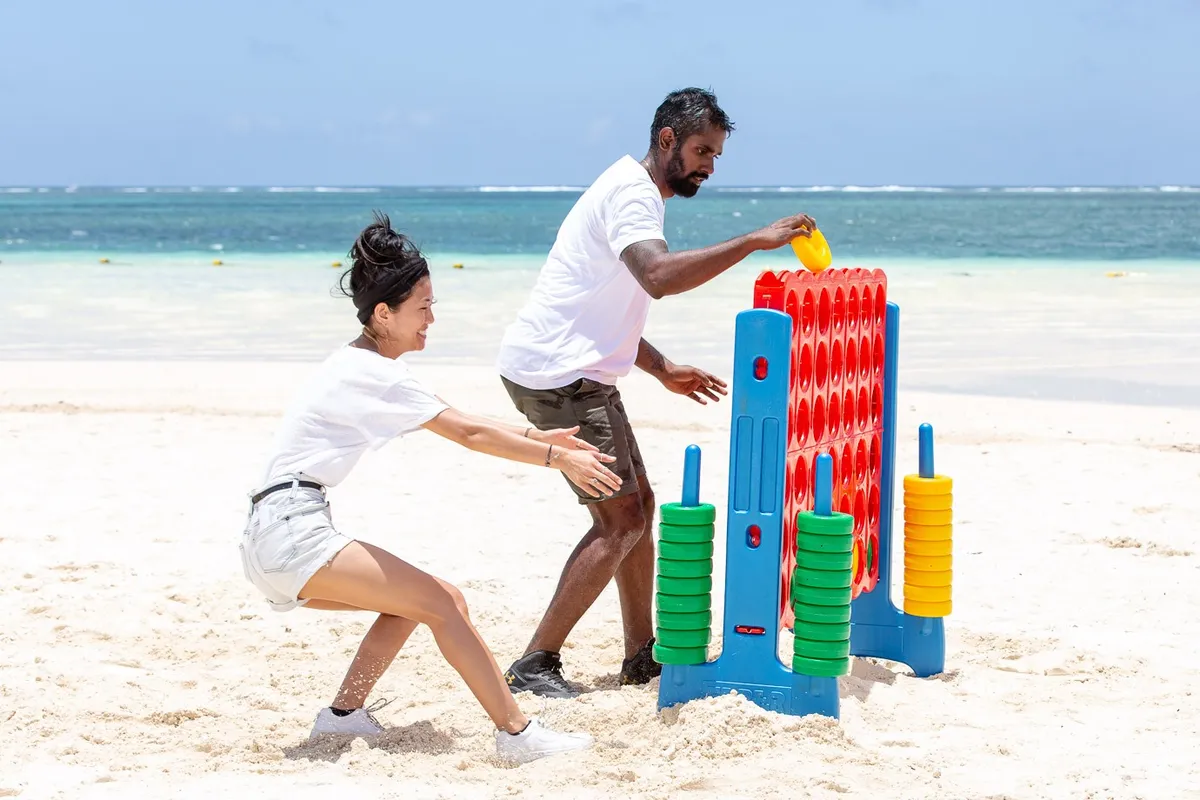 Giant Connect Four by turquoise water