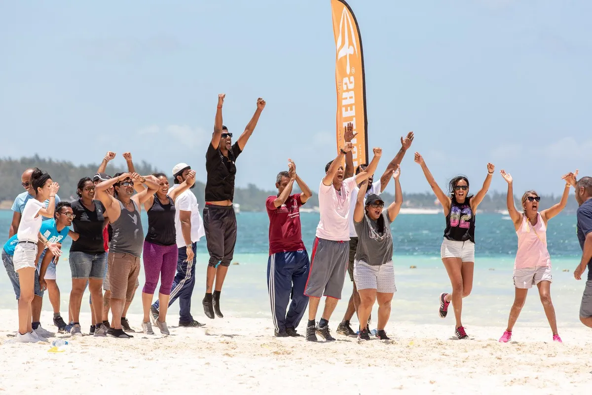 Group jumping celebration by the ocean