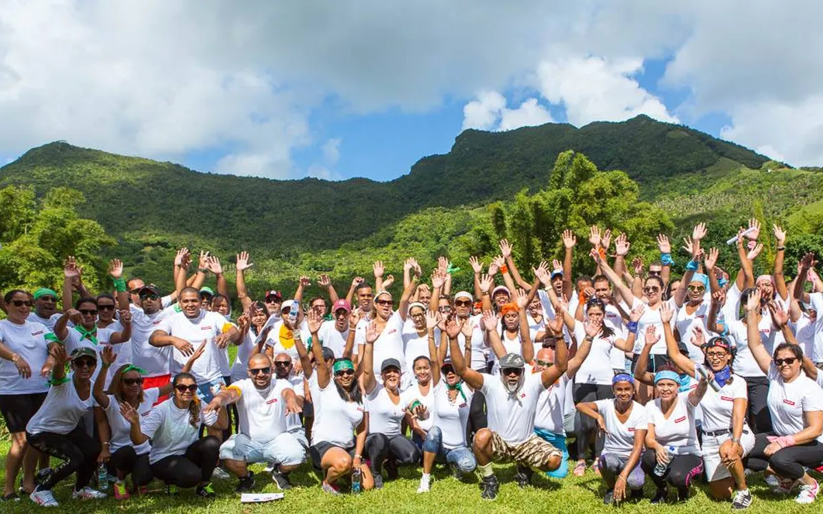 Corporate team building group photo with mountains in Mauritius