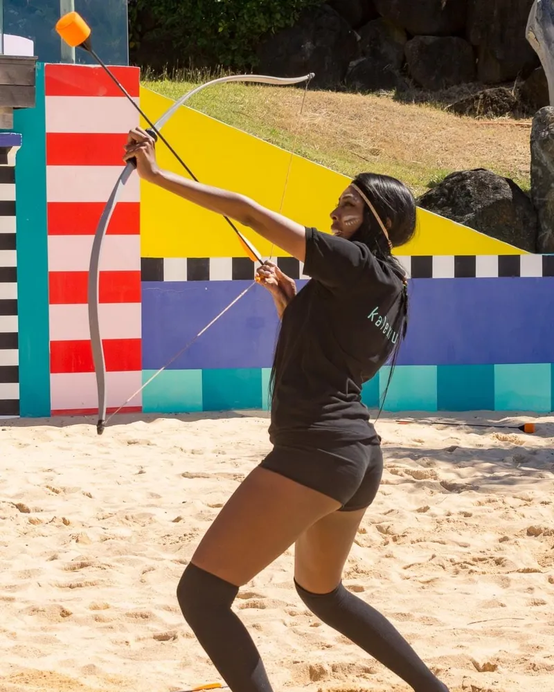 Team crossing adventure bridge in nature during team building activity